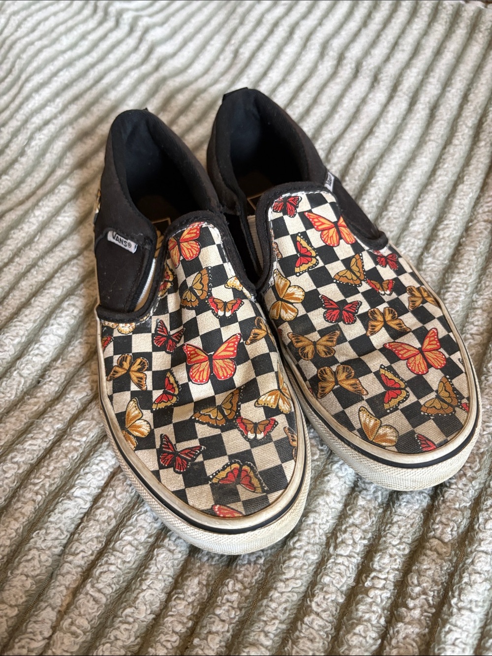 Vans Kids Black & White Checkerboard Slip-Ons with Red and Gold Butterfly Print